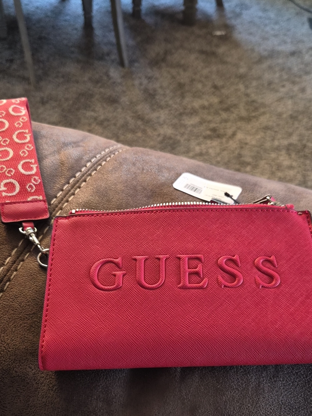 GUESS Pink Embossed Logo Wristlet with Branded Strap